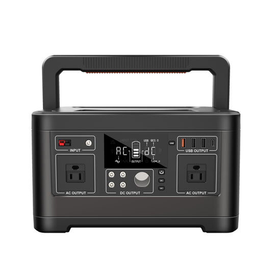 Black portable power station with multiple outlets and display on a white background